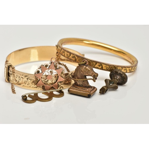 35 - TWO GOLD PLATED HINGED BANGLES, TWO FOB SEALS AND A PENDANT, to include a floral engraved hinged ban... 