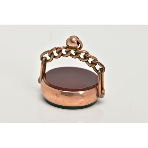 36 - A LATE 19TH CENTURY 9CT GOLD SWIVEL FOB, of a circular form set with bloodstone and carnelian panels... 