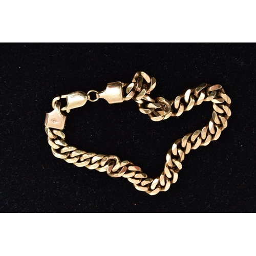 40 - A 9CT GOLD HEAVY CURB LINK BRACELET, a flat curb link bracelet, approximate length 230mm, hallmarked... 