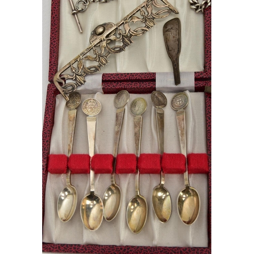 56 - A SELECTION OF SILVER ITEMS, to include a cased set of six silver coffee spoons each set with a thre... 