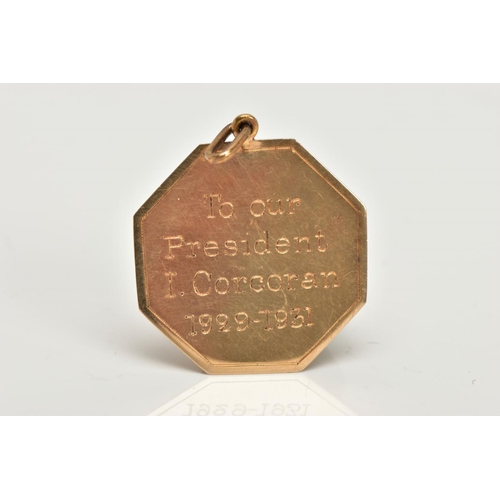 67 - AN EARLY 20TH CENTURY GOLD PENDANT, an octogen shaped medallion style pendant, detailing the letters... 