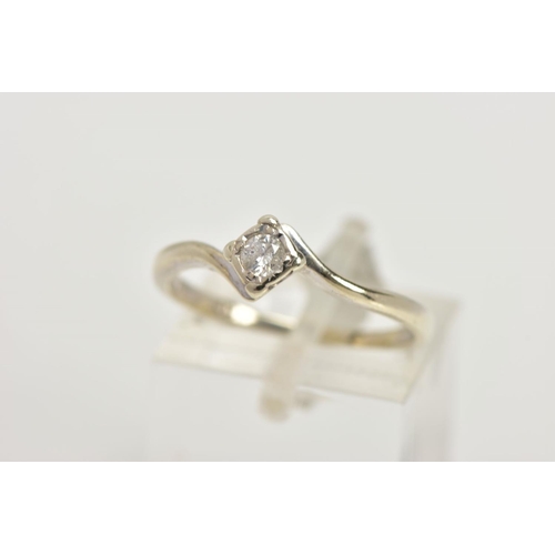 73 - A 9CT GOLD DIAMOND SOLITAIRE RING, a single round brilliant cut diamond set in a four prong illusion... 