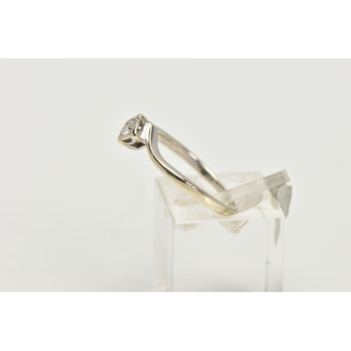 73 - A 9CT GOLD DIAMOND SOLITAIRE RING, a single round brilliant cut diamond set in a four prong illusion... 