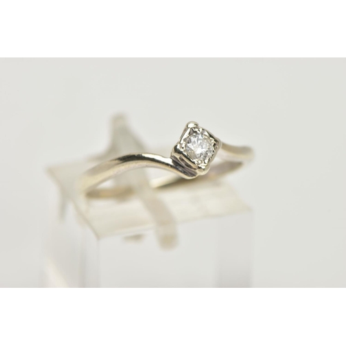 73 - A 9CT GOLD DIAMOND SOLITAIRE RING, a single round brilliant cut diamond set in a four prong illusion... 