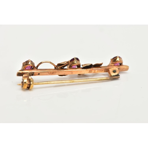 78 - A 9CT GOLD BAR BROOCH, a yellow gold foliage bar brooch, set with three oval cut pink stones, approx... 