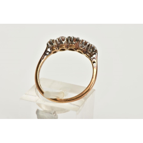 82 - A YELLOW METAL FIVE STONE DIAMOND RING, set with four old cut diamonds and one round brilliant cut d... 