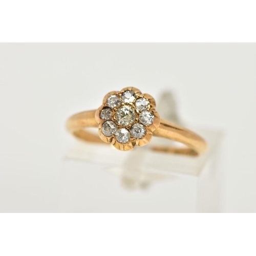 83 - A YELLOW METAL DIAMOND FLOWER RING, flower design set with old cut diamonds, estimated total diamond... 