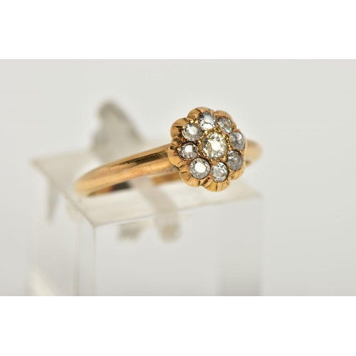 83 - A YELLOW METAL DIAMOND FLOWER RING, flower design set with old cut diamonds, estimated total diamond... 