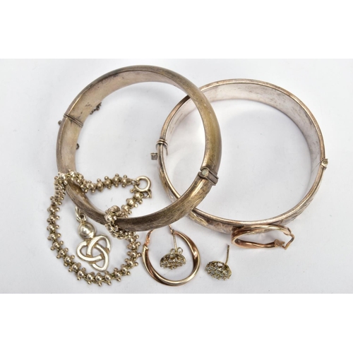 94 - TWO SILVER BANGLES, EARRINGS AND A BRACELET, to include a wide hinged bangle decorated with a floral... 