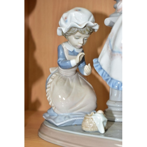 480 - A LLADRO FIGURE GROUP AND A LLADRO FIGURE, comprising A Stitch In Time, no.5344, sculpted by Regino ... 