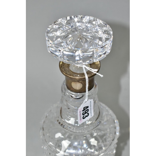 493 - A MODERN CLEAR GLASS DECANTER WITH HALLMARKED SILVER COLLAR, circular stopper, double ring neck abov... 