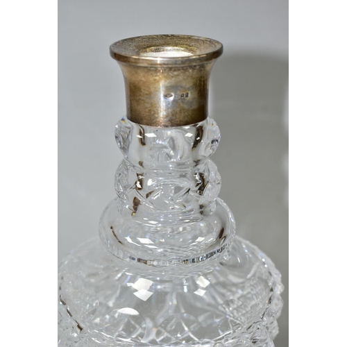 493 - A MODERN CLEAR GLASS DECANTER WITH HALLMARKED SILVER COLLAR, circular stopper, double ring neck abov... 