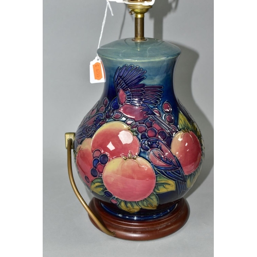 508 - A MOORCROFT POTTERY BALUSTER TABLE LAMP DECORATED WITH FINCHES AND FRUIT, blue green ground, mounted... 