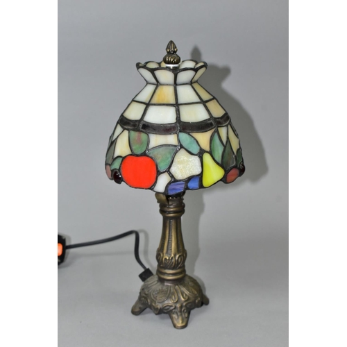 509 - A MODERN BEDSIDE LAMP WITH A LEADED  GLASS SHADE,  cast metal base, overall height 32cm