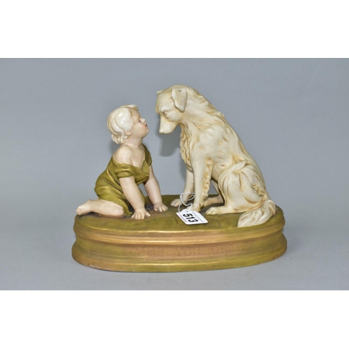 513 - A ROYAL DUX FIGURE OF A BABY AND A SEATED DOG ON AN OVAL BASE INDISCTINCTLY STAMPED 'CAN'T YOU TALK'... 