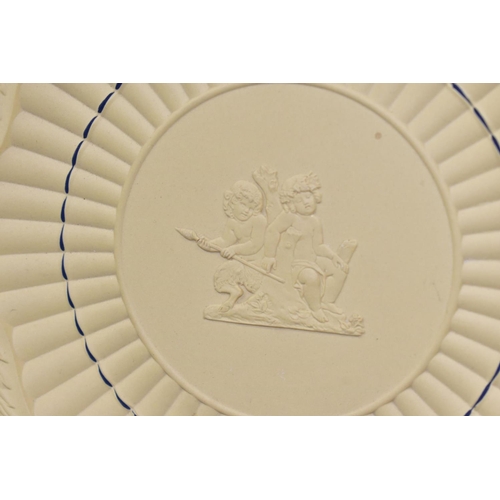 517 - A 20TH CENTURY WEDGWOOD CANEWARE BREAD AND BUTTER PLATE, moulded grains of corn rim, faun and putti ... 