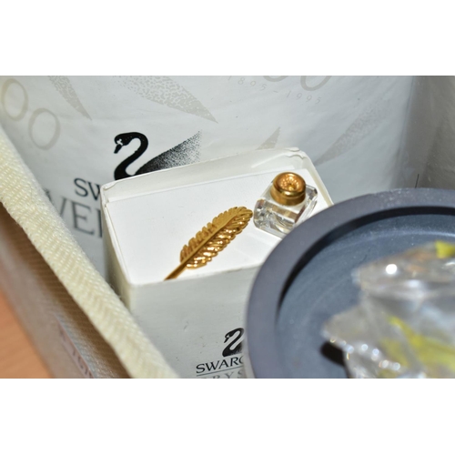 525 - SEVEN BOXED SWAROVSKI CRYSTAL ITEMS, comprising mini Blowfish 013960, Crystal Memories bell and ink ... 