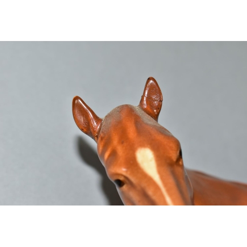 534 - A BESWICK MARE FACING LEFT IN CHESTNUT GLOSS, model no.976 (Condition report: both ears have been da... 