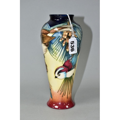 536 - A MOORCROFT POTTERY BALUSTER VASE DECORATED WITH THREE BIRDS IN THE BRANCHES OF A PINE TREE, impress... 