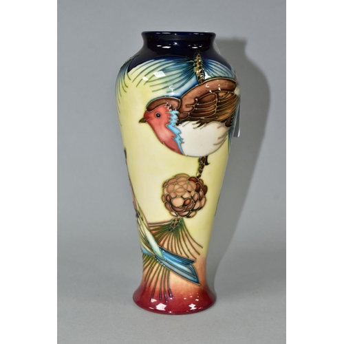 536 - A MOORCROFT POTTERY BALUSTER VASE DECORATED WITH THREE BIRDS IN THE BRANCHES OF A PINE TREE, impress... 