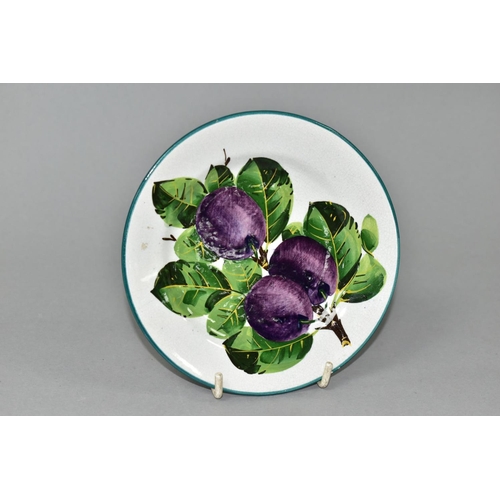 537 - A WEMYSS TEA PLATE PAINTED WITH PURPLE PLUMS ON A SECTION OF BRANCH, retailed by T. Goode & Co, prin... 