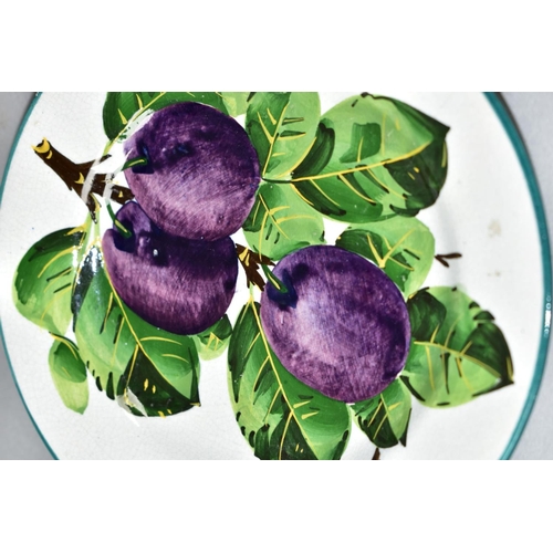 537 - A WEMYSS TEA PLATE PAINTED WITH PURPLE PLUMS ON A SECTION OF BRANCH, retailed by T. Goode & Co, prin... 