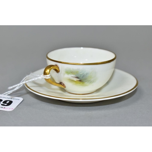 539 - A ROYAL WORCESTER MINIATURE CUP AND SAUCER, the ivory ground painted with a Redstart to the cup and ... 