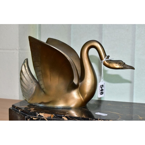 548 - AN ART DECO STYLE SCULPTURE OF TWO GILT METAL SWANS ON A SHAPED RECTANGULAR MARBLE PLINTH, after Mou... 