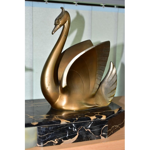 548 - AN ART DECO STYLE SCULPTURE OF TWO GILT METAL SWANS ON A SHAPED RECTANGULAR MARBLE PLINTH, after Mou... 