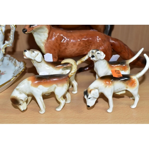 554 - A BESWICK HUNTSWOMAN, HOUNDS AND FOX FIGURES, comprising Huntswoman on Brown Horse 1730 height 21cm,... 