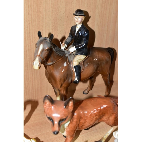 554 - A BESWICK HUNTSWOMAN, HOUNDS AND FOX FIGURES, comprising Huntswoman on Brown Horse 1730 height 21cm,... 