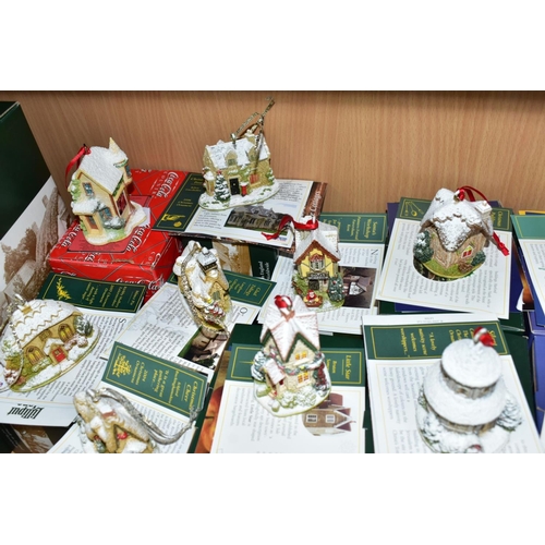 557 - EIGHTEEN BOXED CHRISTMAS THEMED LILLIPUT LANE SCULPTURES, comprising sixteen Christmas Annual Orname... 