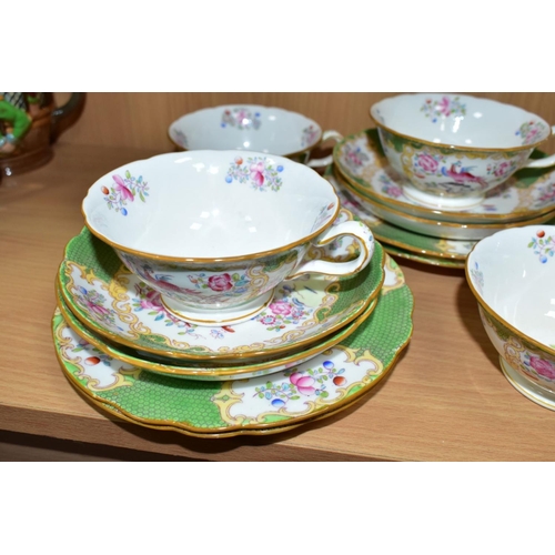 558 - A NINETEEN PIECE MINTONS 'GREEN COCKATRICE' PATTERN TEA SET, pattern 4863, comprising a cake plate, ... 