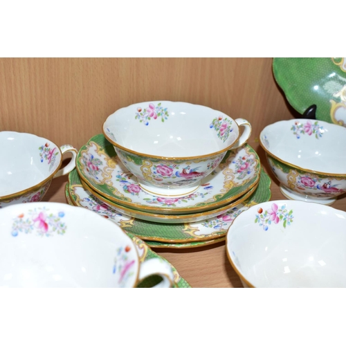 558 - A NINETEEN PIECE MINTONS 'GREEN COCKATRICE' PATTERN TEA SET, pattern 4863, comprising a cake plate, ... 