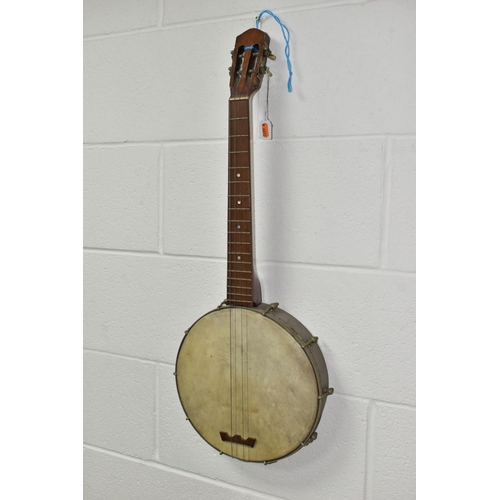 561 - A VINTAGE BANJO, open backed, with a metal body and mother of pearl inlaid neck, approximate length ... 