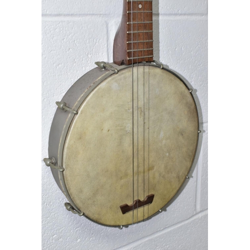 561 - A VINTAGE BANJO, open backed, with a metal body and mother of pearl inlaid neck, approximate length ... 