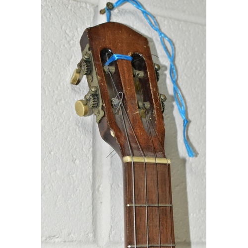 561 - A VINTAGE BANJO, open backed, with a metal body and mother of pearl inlaid neck, approximate length ... 