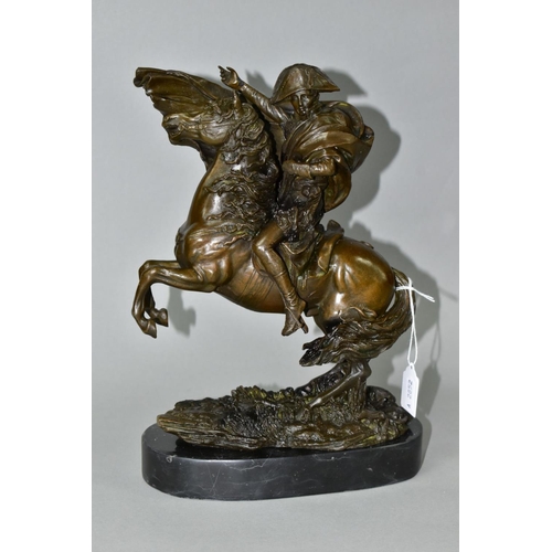 563 - A BOXED REPRODUCTION BRONZE OF NAPOLEON ON HORSEBACK, on a marble style plinth, approximate height 2... 