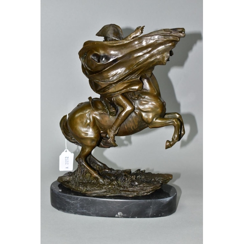 563 - A BOXED REPRODUCTION BRONZE OF NAPOLEON ON HORSEBACK, on a marble style plinth, approximate height 2... 