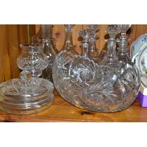 568 - EIGHT DECANTERS AND OTHER PIECES OF CUT GLASS, to include a French sectional decanter (missing stopp... 