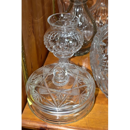 568 - EIGHT DECANTERS AND OTHER PIECES OF CUT GLASS, to include a French sectional decanter (missing stopp... 