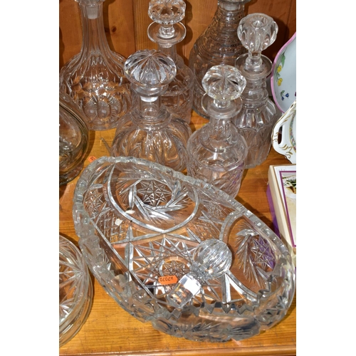 568 - EIGHT DECANTERS AND OTHER PIECES OF CUT GLASS, to include a French sectional decanter (missing stopp... 