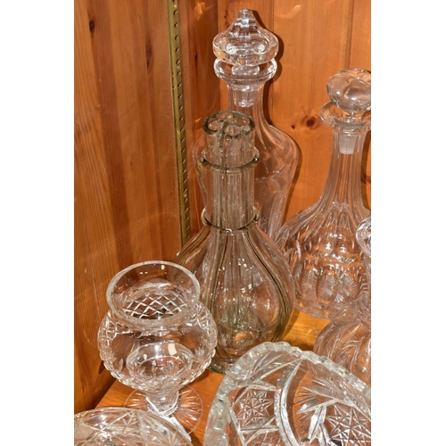 568 - EIGHT DECANTERS AND OTHER PIECES OF CUT GLASS, to include a French sectional decanter (missing stopp... 