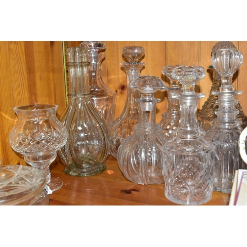 568 - EIGHT DECANTERS AND OTHER PIECES OF CUT GLASS, to include a French sectional decanter (missing stopp... 