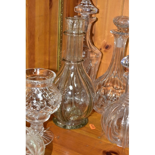 568 - EIGHT DECANTERS AND OTHER PIECES OF CUT GLASS, to include a French sectional decanter (missing stopp... 