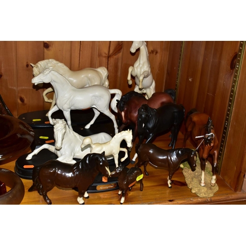 569 - ELEVEN BESWICK AND ROYAL DOULTON HORSE FIGURES, comprising Royal Doulton The Winner DA154B/2 on natu... 