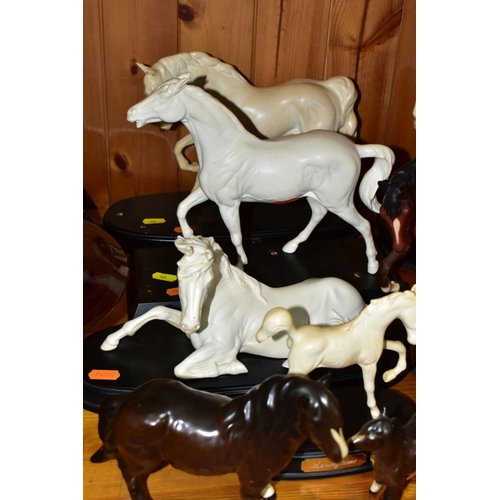 569 - ELEVEN BESWICK AND ROYAL DOULTON HORSE FIGURES, comprising Royal Doulton The Winner DA154B/2 on natu... 