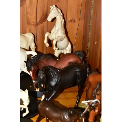 569 - ELEVEN BESWICK AND ROYAL DOULTON HORSE FIGURES, comprising Royal Doulton The Winner DA154B/2 on natu... 