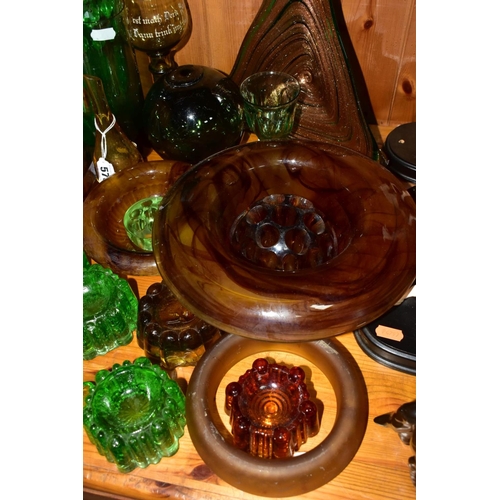 570 - A GROUP OF GREEN, BROWN AND URANIUM GLASSWARES, to include pressed glass furniture rests/piano insul... 