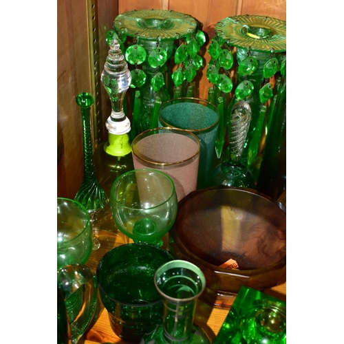 570 - A GROUP OF GREEN, BROWN AND URANIUM GLASSWARES, to include pressed glass furniture rests/piano insul... 